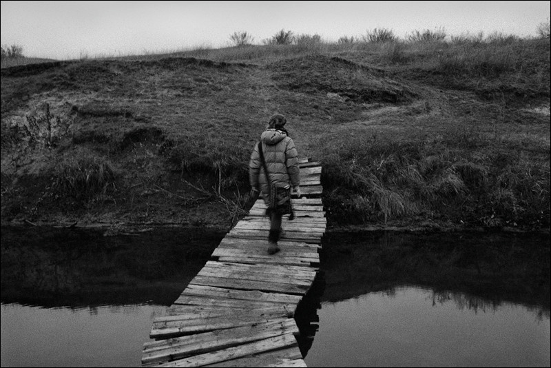 "Through a planked footway of the river of Beriozovaya", farm of Senshin, village of Oblivskaya district, Rostov-on-Don region, Russia, January 2011