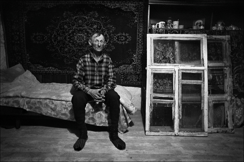 "Portrait of Jurka Shutenko on the background of the carpet and remove the old windows", farm of Senshin, village of Oblivskaya district, Rostov-on-Don region, Russia, November 2010