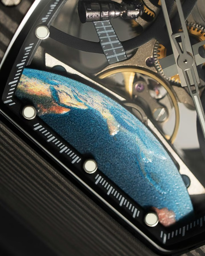 Macro view of a luxury watch movement with gears and a blue globe detail
