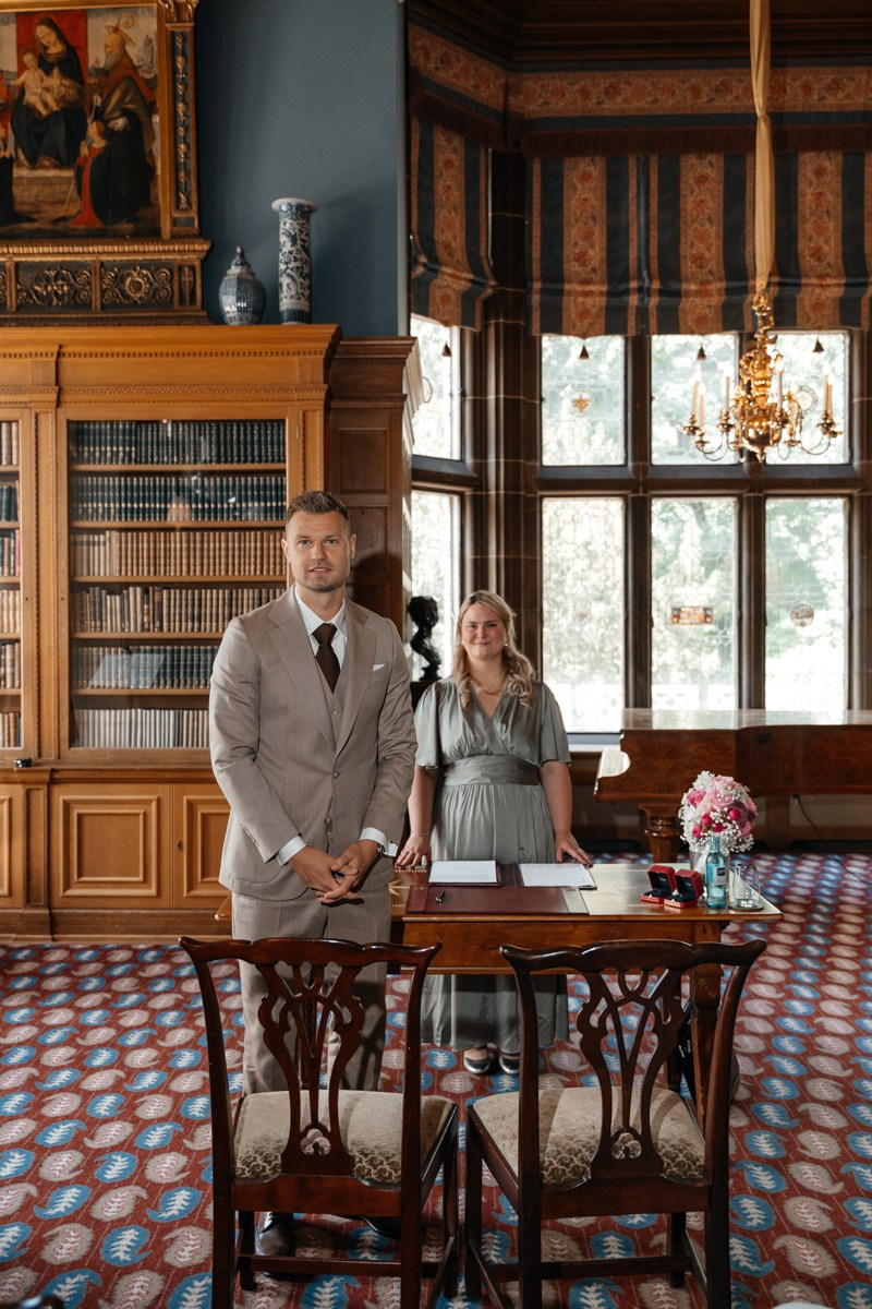 groom is waiting for his bride in library