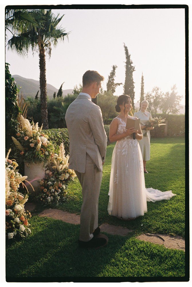 Bride and groom exchanging vows during Morocco outdoor wedding ceremony