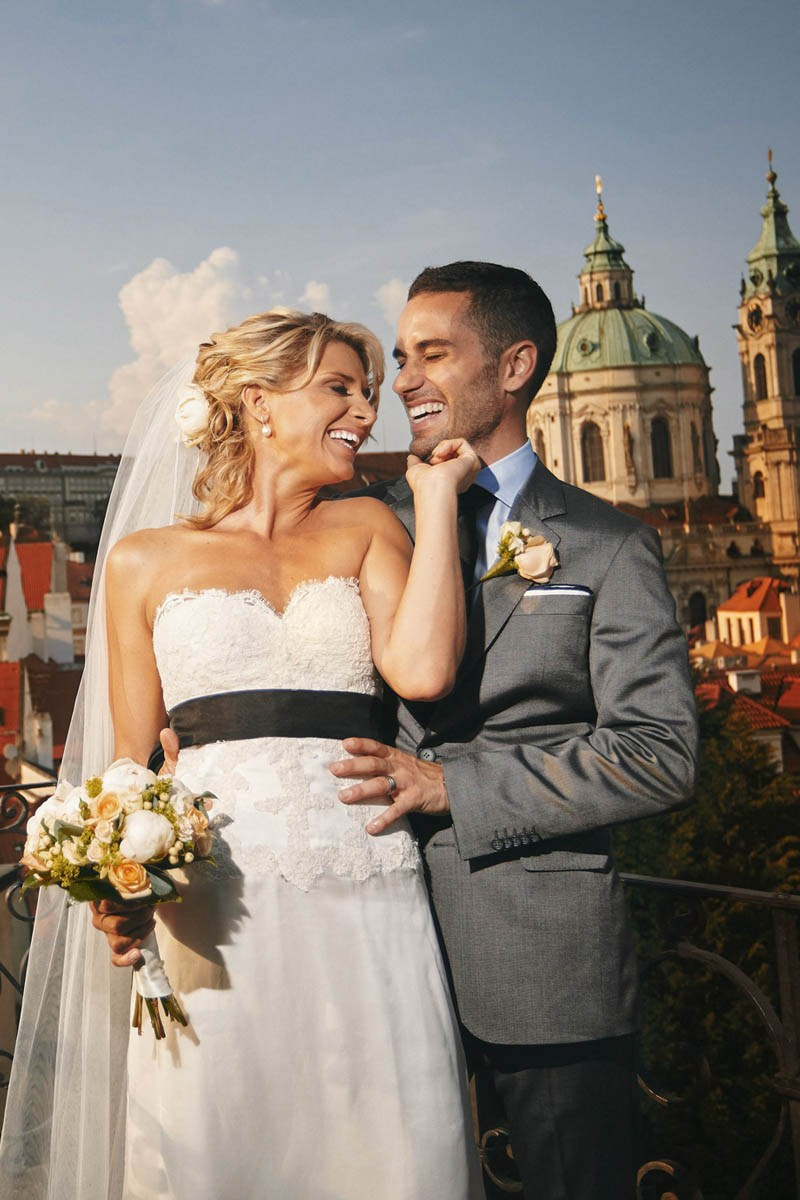 Joyful bride touching groom’s face in golden light, Vrtba Garden wedding