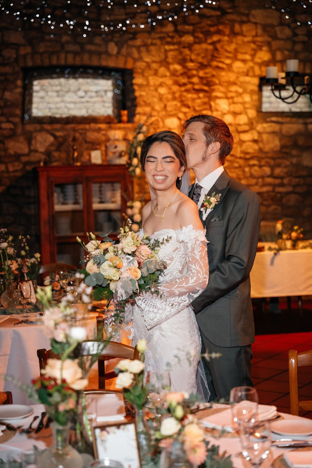 classic portrait of the couple between tables