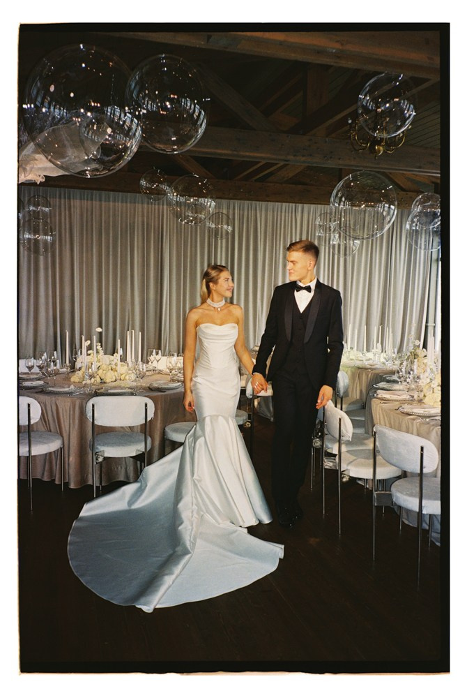 Bride and groom entering reception during luxury wedding celebration