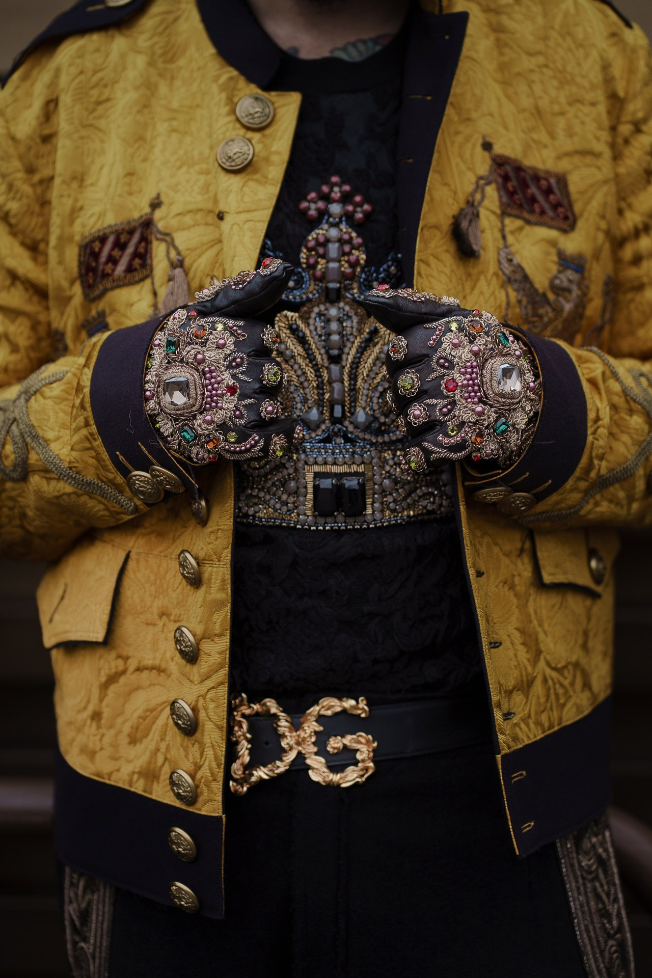 Man wearing ornate embroidered jacket at Pitti Uomo 109 Florence