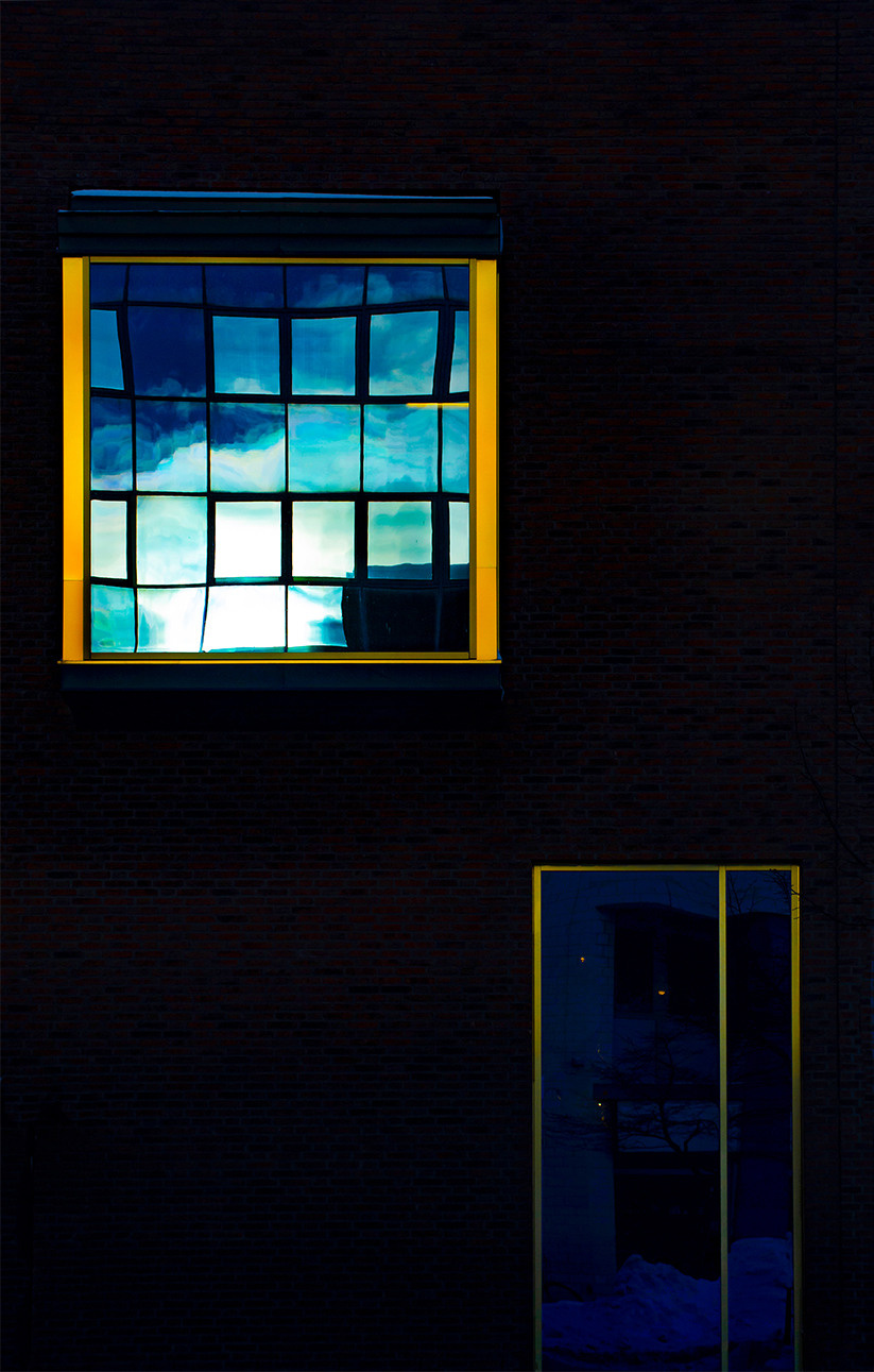 Reflection of the sky in the window street photo