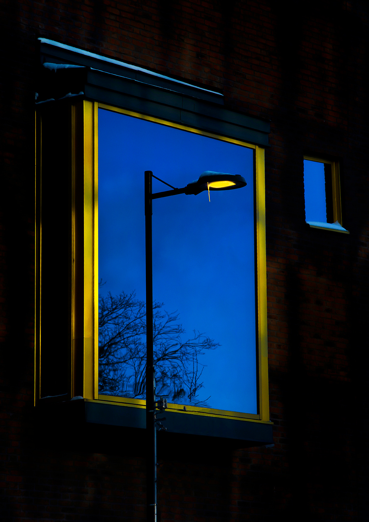 Reflection of a lantern in the window street photo