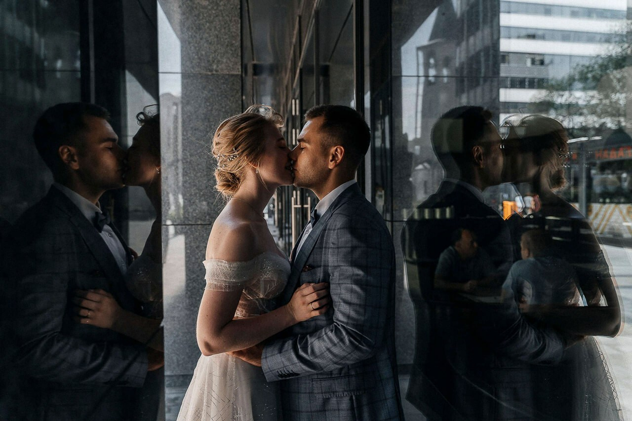Bride and groom enjoying a private moment at a romantic London location.
