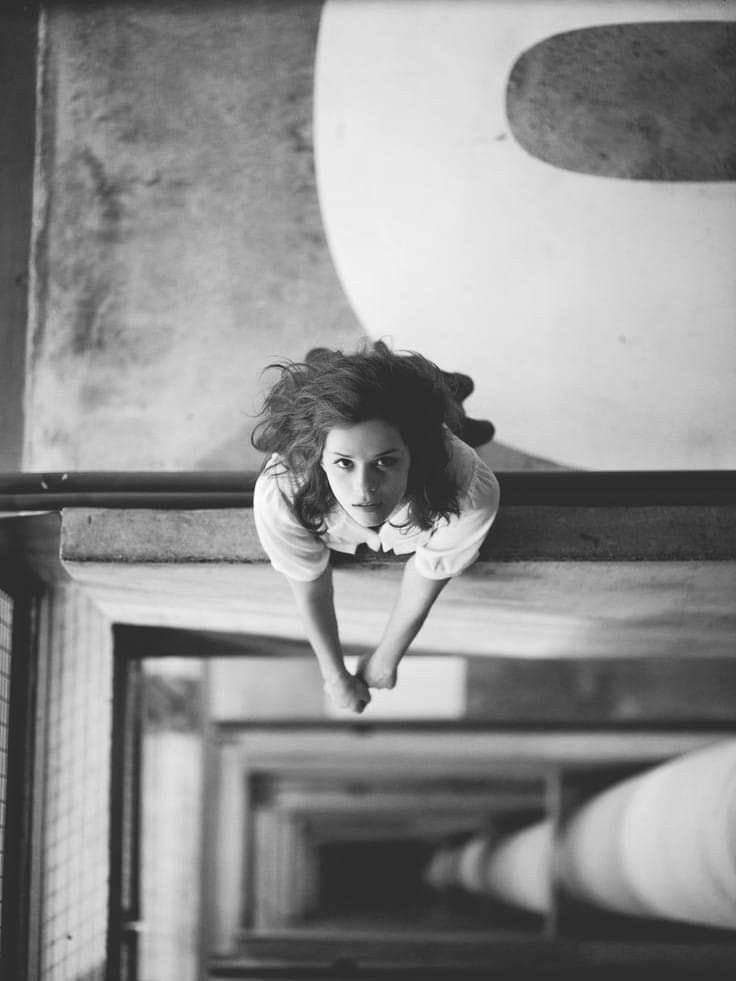 Mysterious Model on a Staircase – Captivating Urban Photography