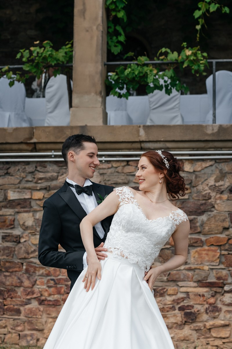 bride and groom looking to each other 
