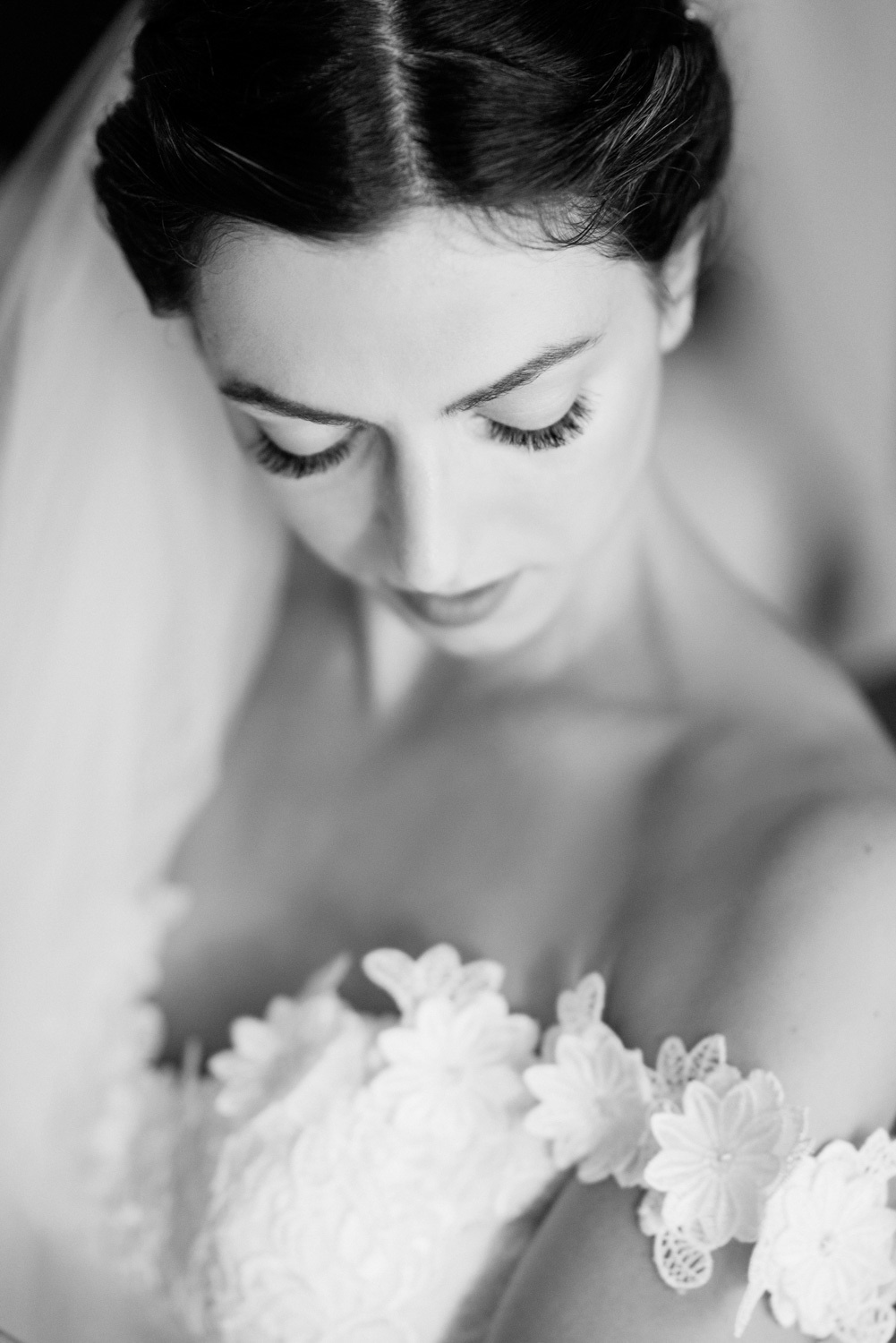 The bride in a wedding dress and veil.