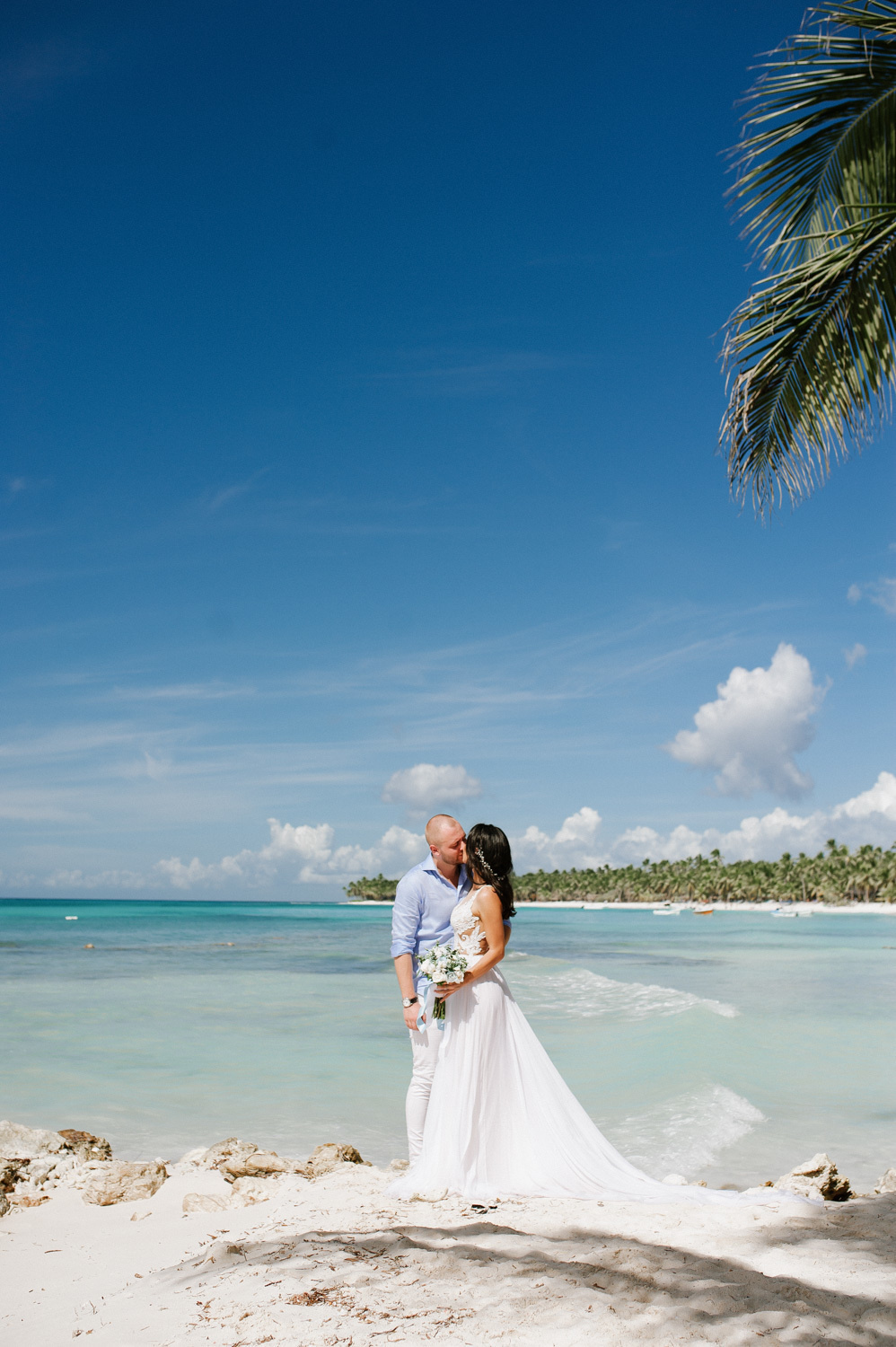 Bride and groom on the background of the sea bay.