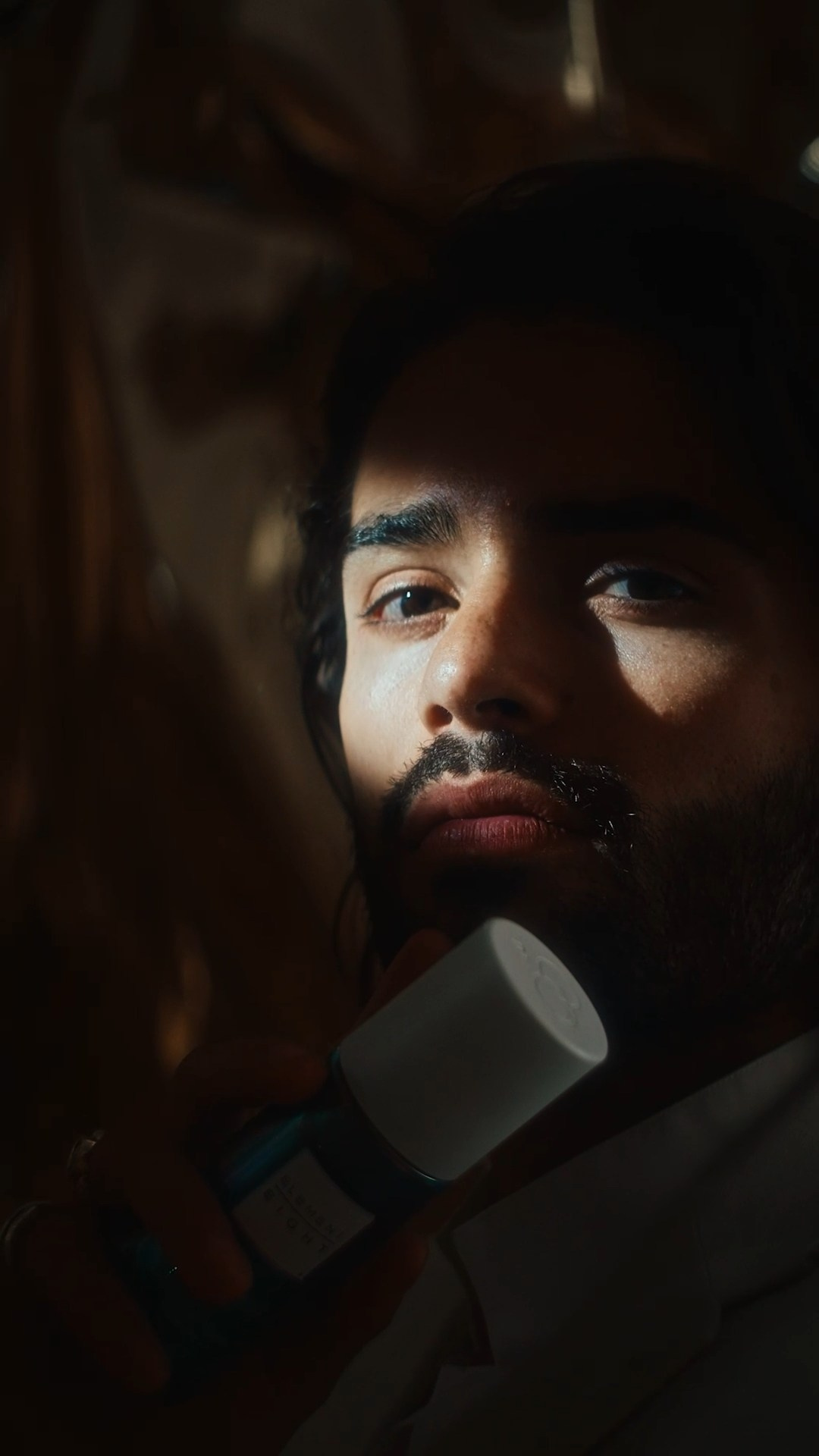 Dramatic portrait of a model in cinematic lighting, representing high-end fashion storytelling.