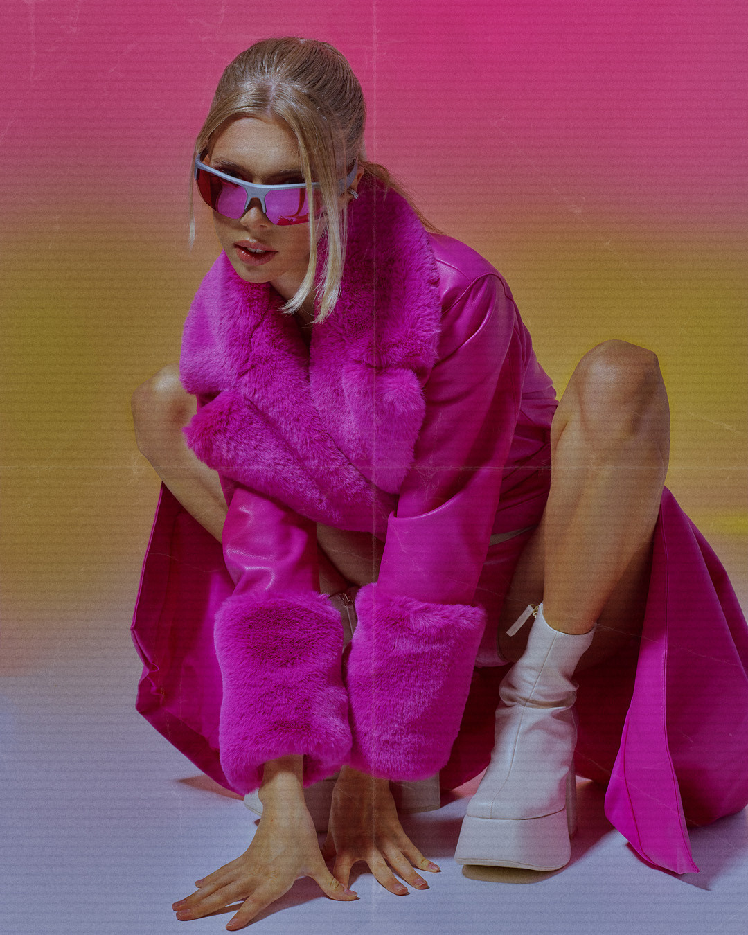 Fashion-forward studio image combining minimalist makeup with high-impact visual storytelling.