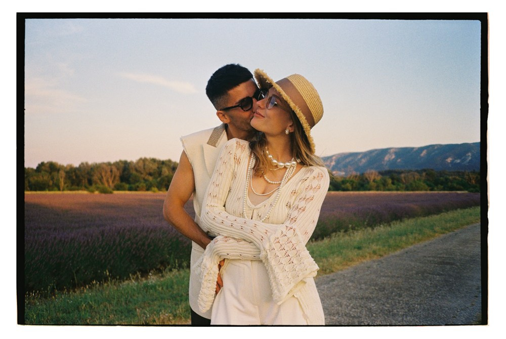Couple embracing in Provence France lavender field during destination wedding portraits
