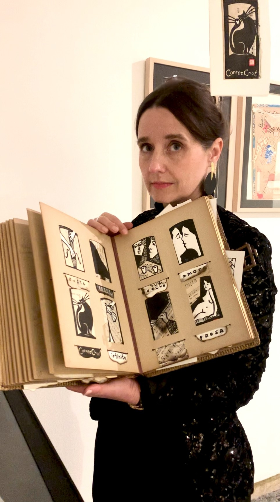 Artist Nadia Kuprina holding her artist book “Banalités Précieuses” during Illustrations Exposition in Venice, Italy. January 2025