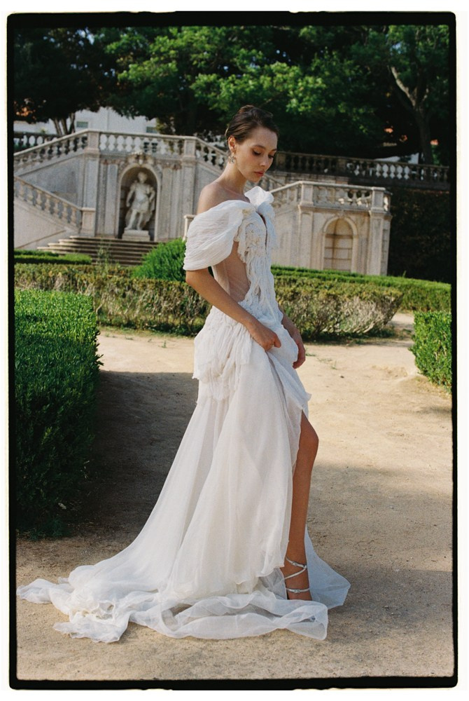 Bride standing in garden during Portugal editorial wedding portraits