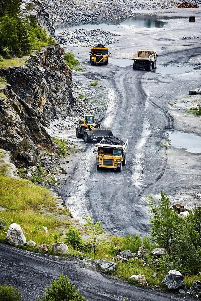 Heavy equipment in a Czech quarry, industrial stock.