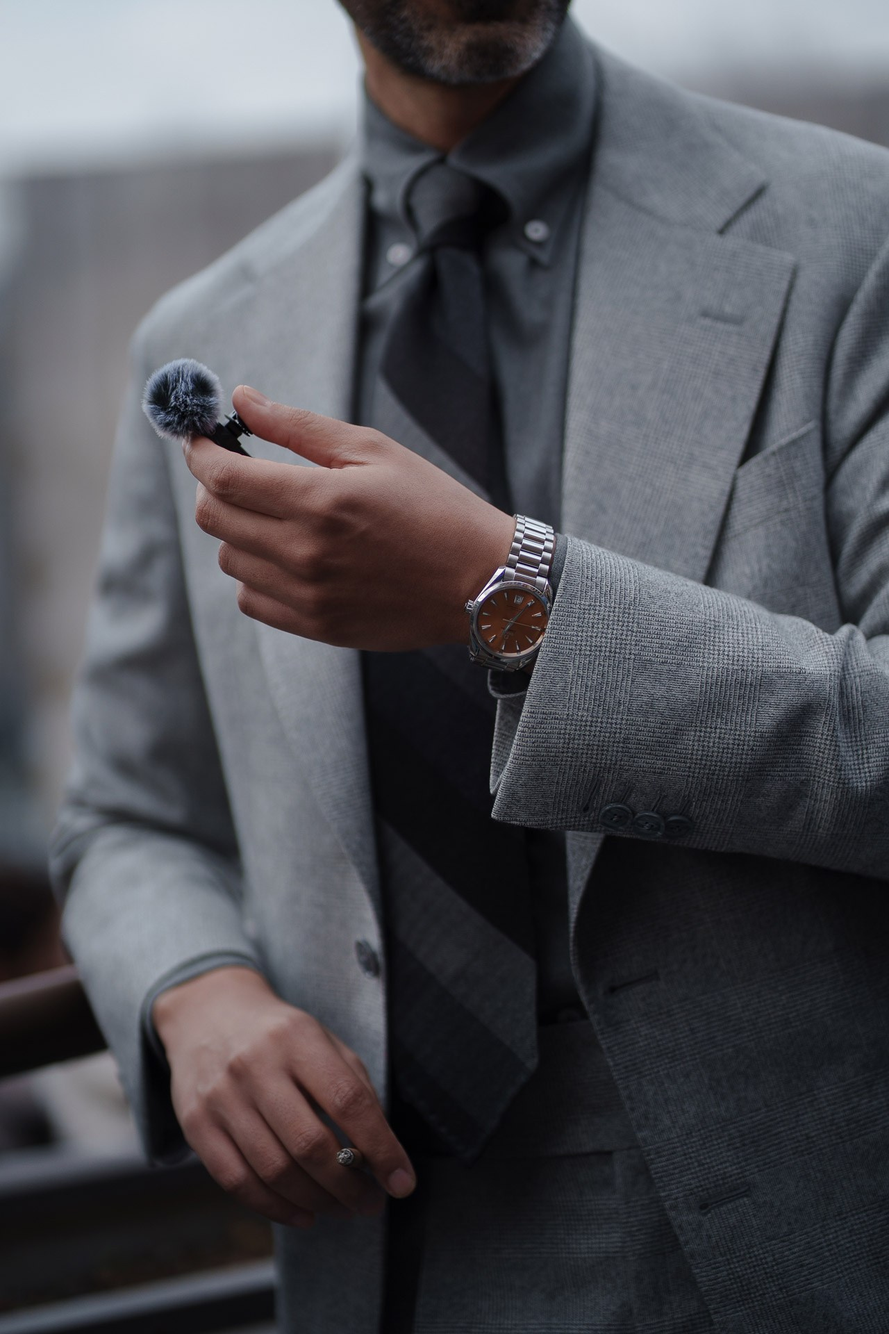 Close up of grey suit with lapel microphone during Pitti Uomo Florence