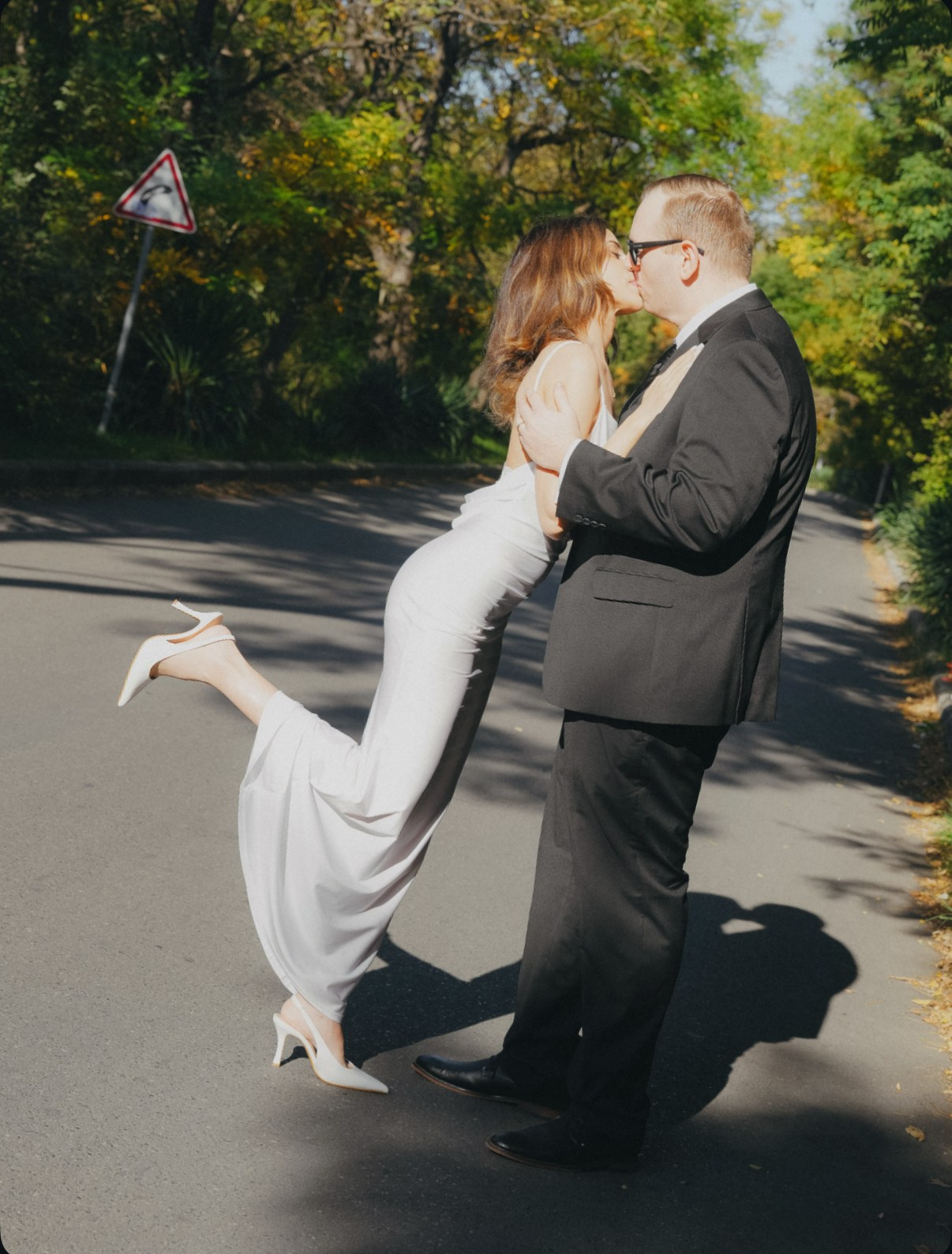 Couple kissing at Lisi lake location, Tbilisi, during their wedding photo shoot