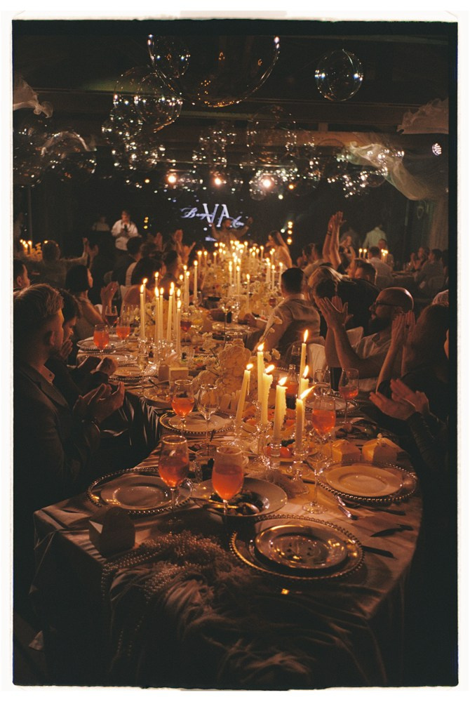 Candlelit reception table during luxury wedding dinner