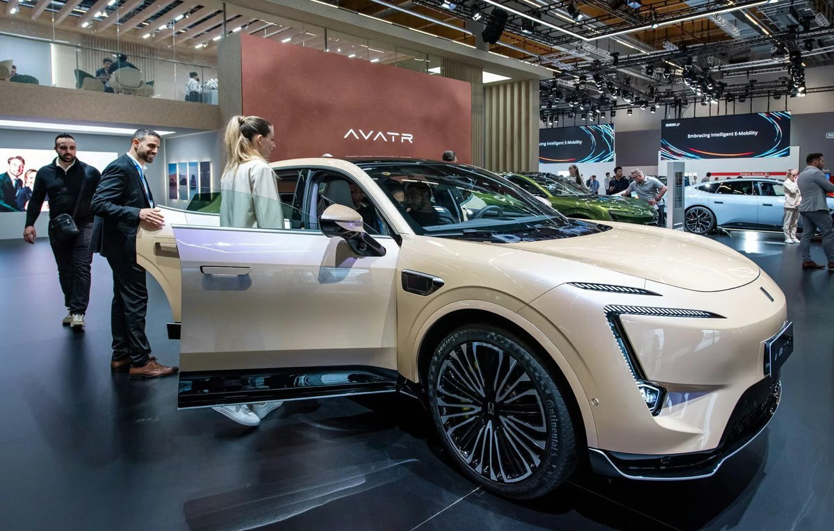 White vehicle displayed at an automotive trade show in the UAE