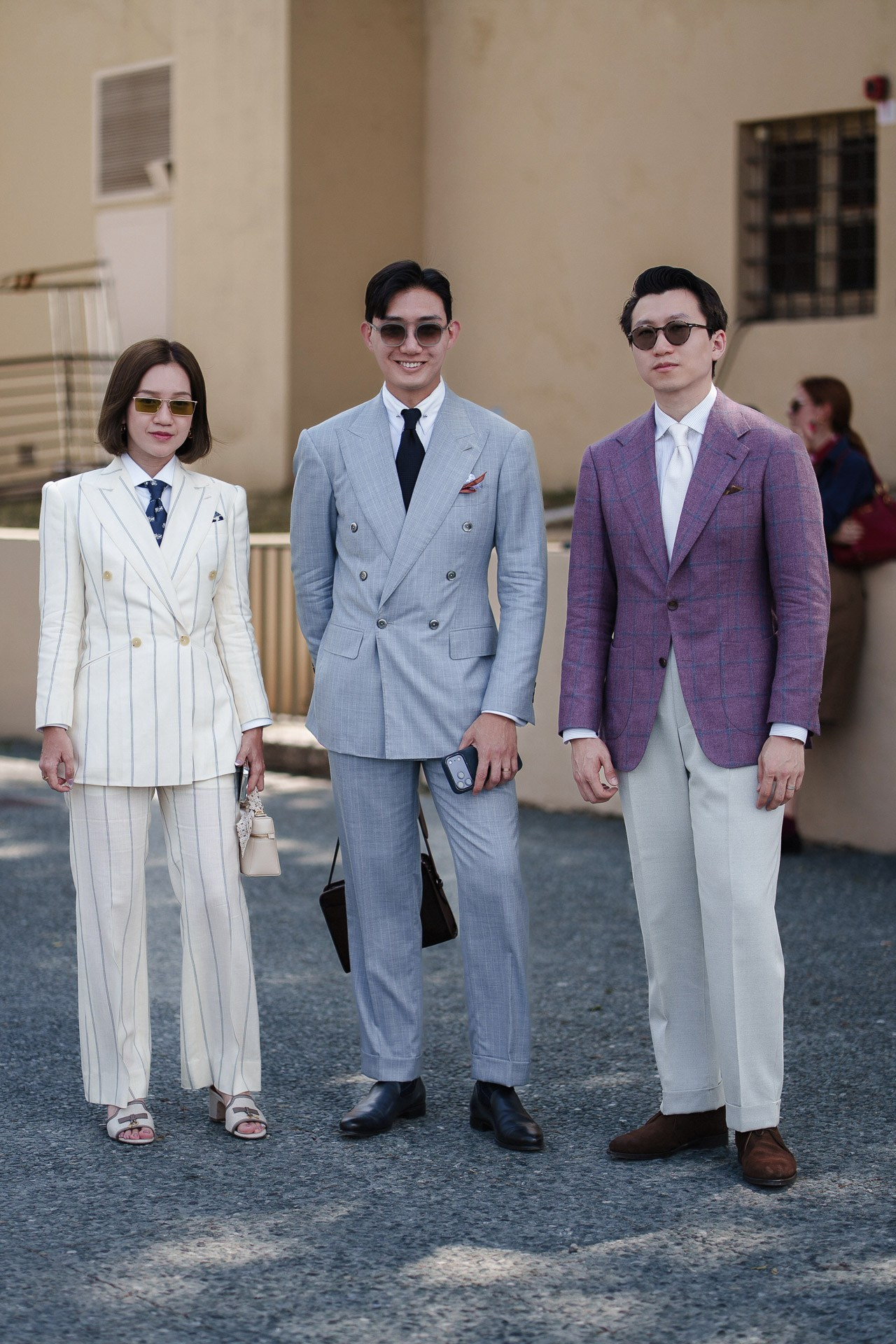 Group street style portrait from Pitti Uomo 110 with guests in tailored summer looks