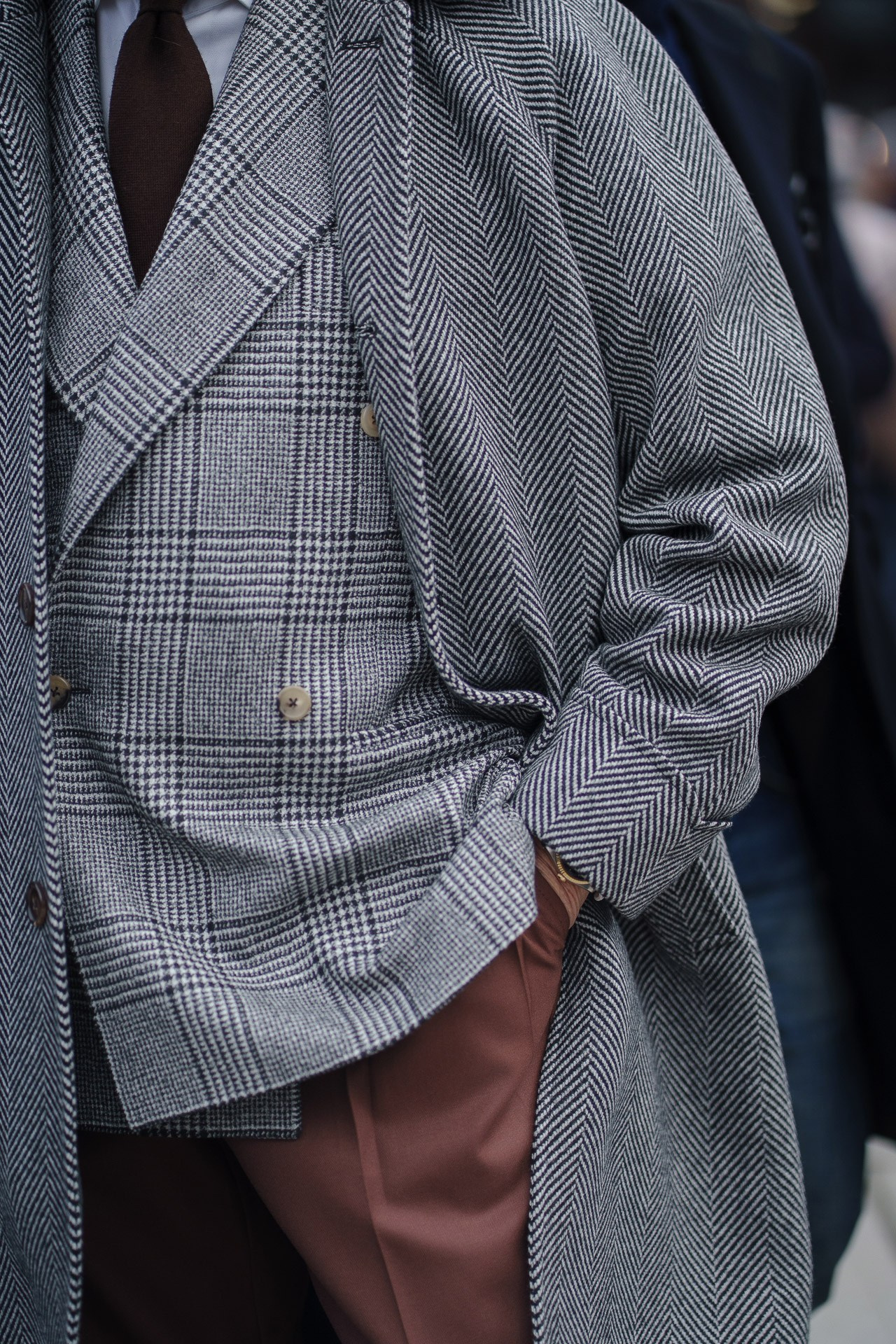 Close up of grey tweed suit and brown trousers at Pitti Uomo Florence menswear