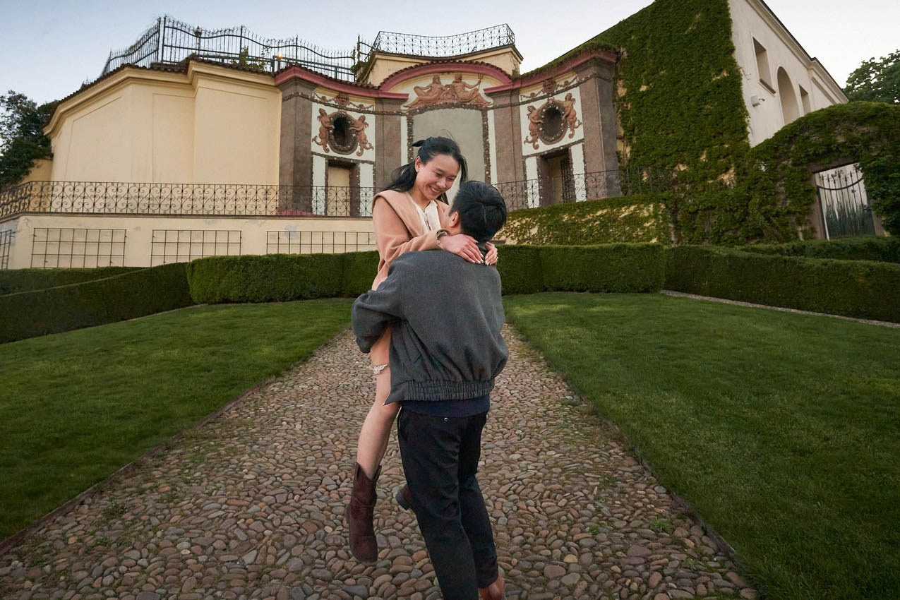 Couple hugging laughing Vrtba Garden Prague engagement photos