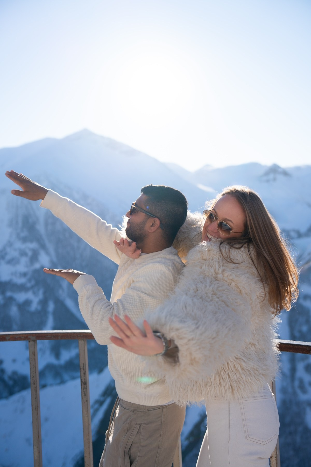 Couple dancing on a viewpoint near Gudauri Ski Resort 