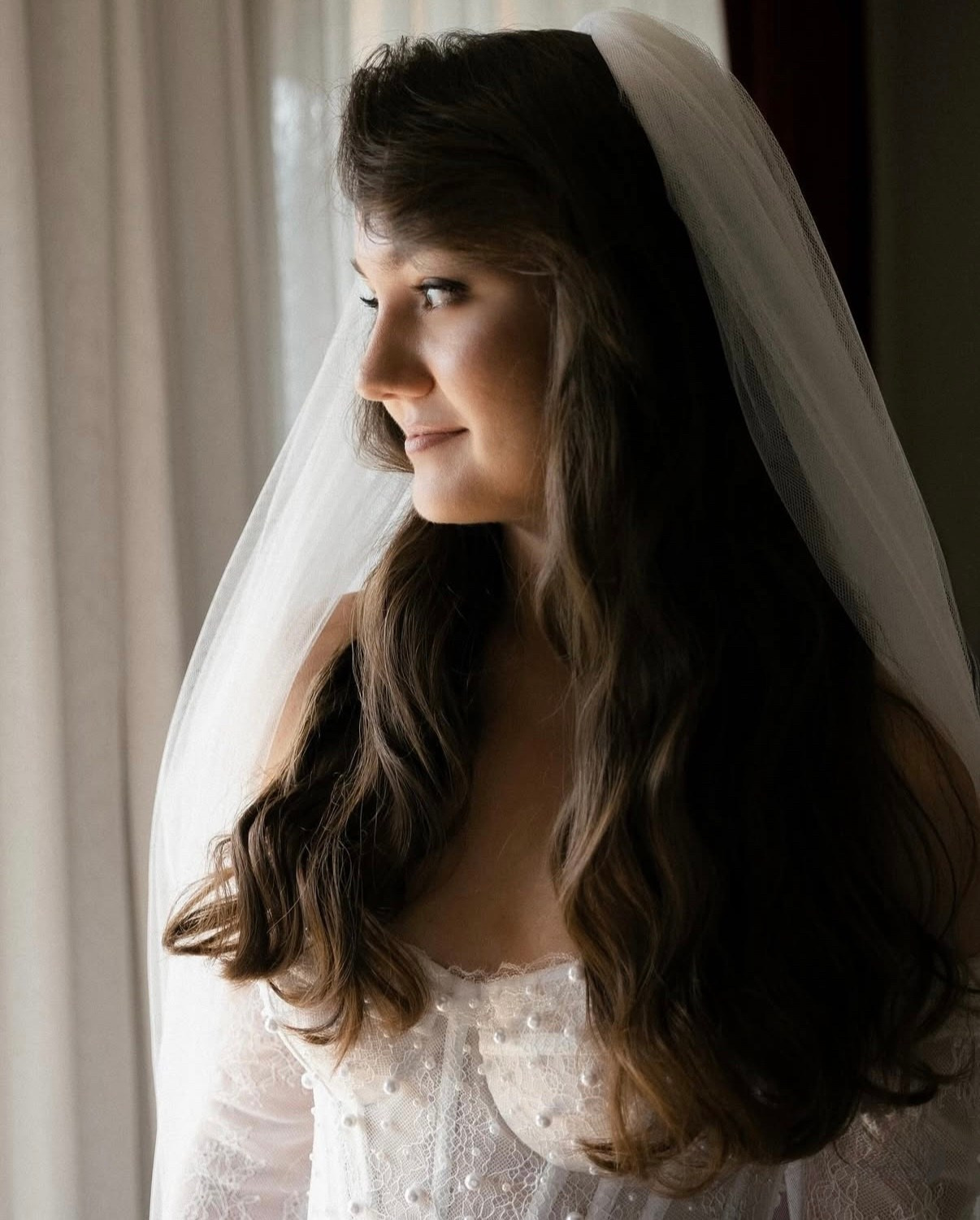 Bride portrait by window in soft light