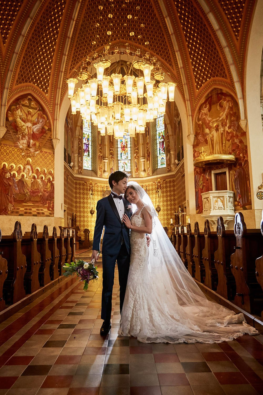 Radiant bride embracing groom center St Martin's Church post-vows.
