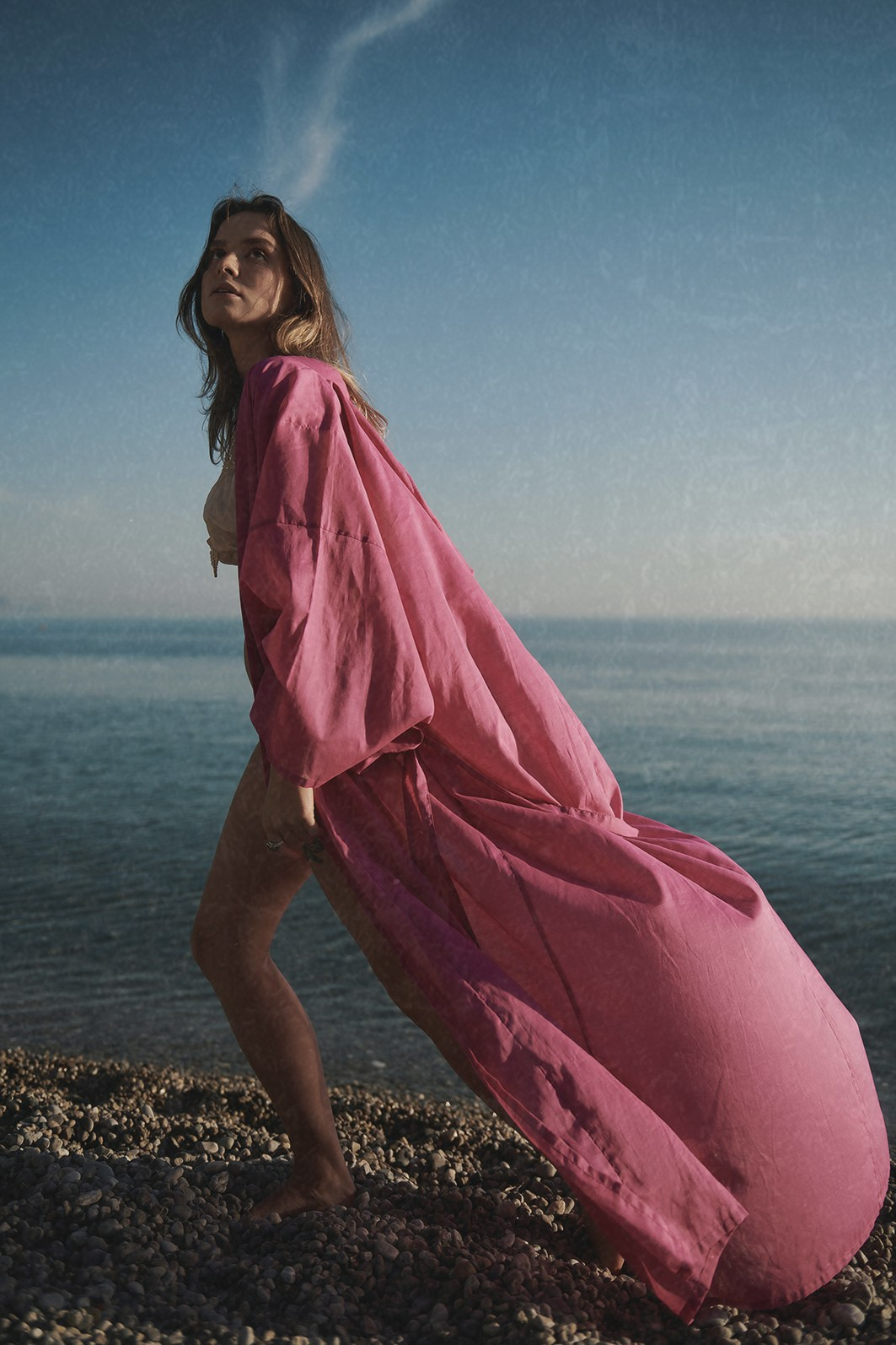 Editorial campaign for a beachwear brand, captured on the seashore in natural light