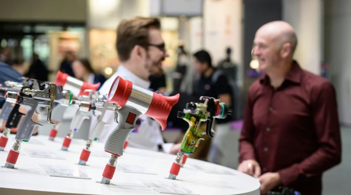Presenter demonstrating products to visitors at an exhibition booth