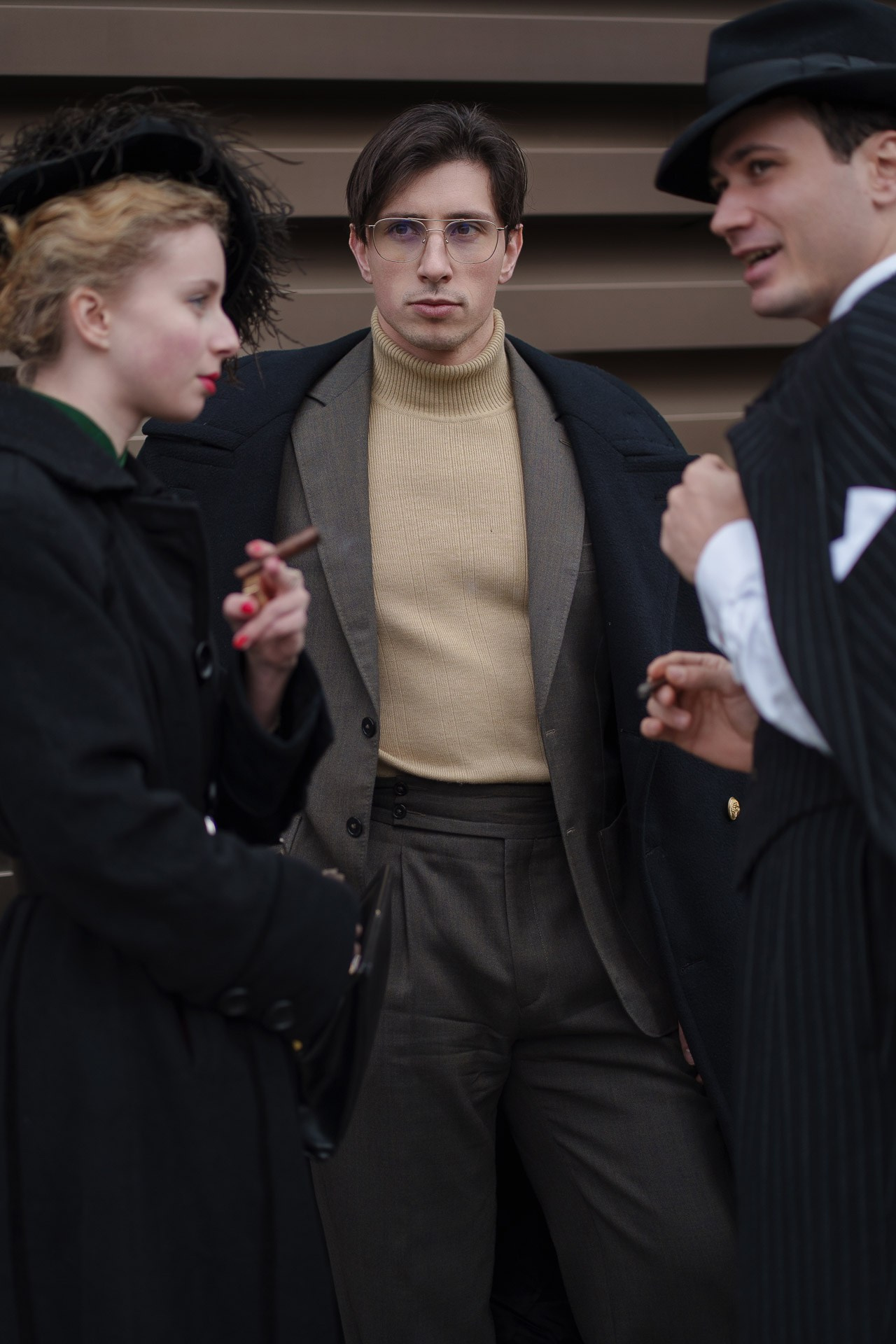 Group of fashionably dressed people talking at Pitti Uomo 109 Florence