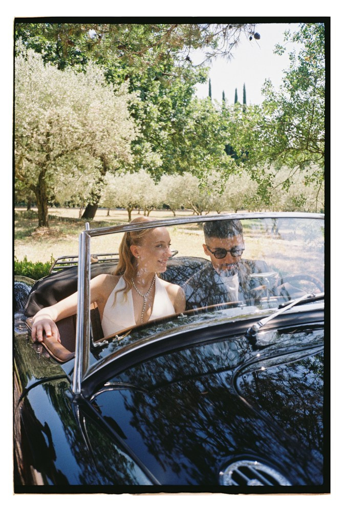 Couple seated in car during destination wedding portraits in Provence, France