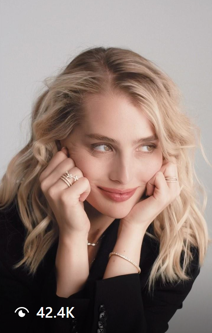 Sabina Kravchenko smiling gracefully in a Mavie jewelry campaign, showcasing delicate rings and bracelets with timeless elegance.
