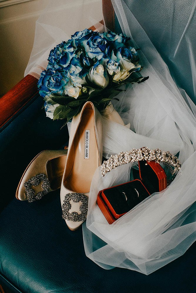 Bride's wedding shoes, veil, rings, and tiara.