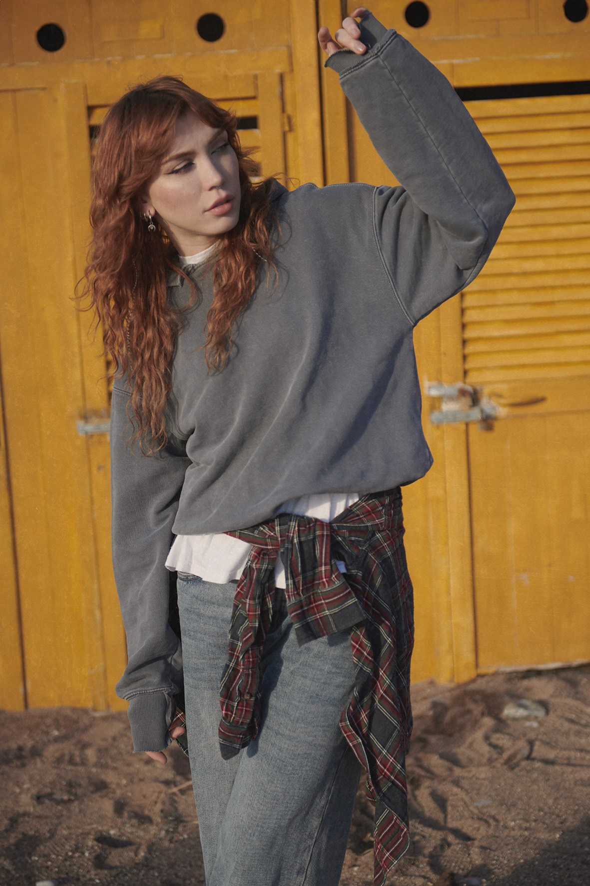 Fashion campaign for a clothing brand, photographed on a seashore in natural light