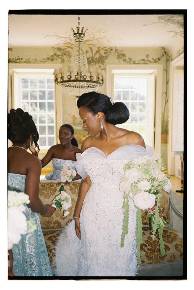 Bride holding bouquet during Nigerian wedding preparation in Portugal