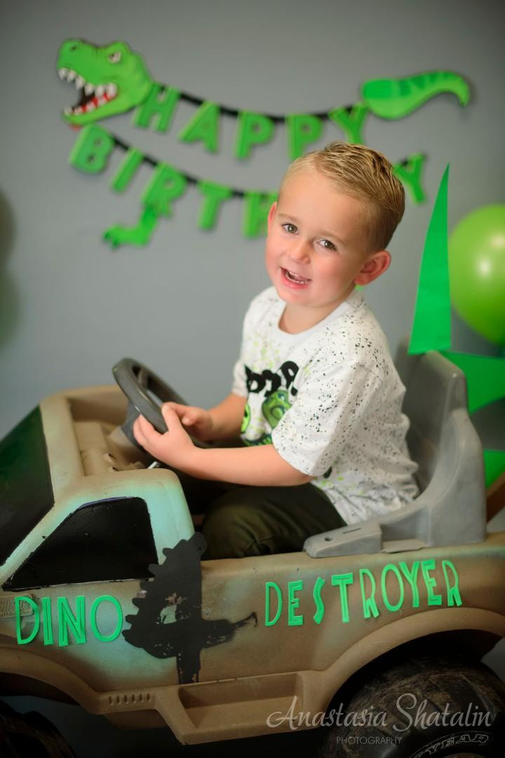 Dinosaur monster truck decorated birthday photography in Lincoln, CA. Family photographer in Roseville, Rocklin, Folsom, Sacramento