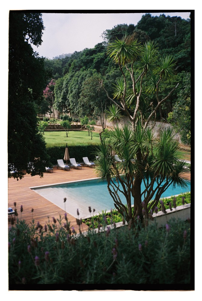 Poolside garden view during Nigerian destination wedding in Portugal