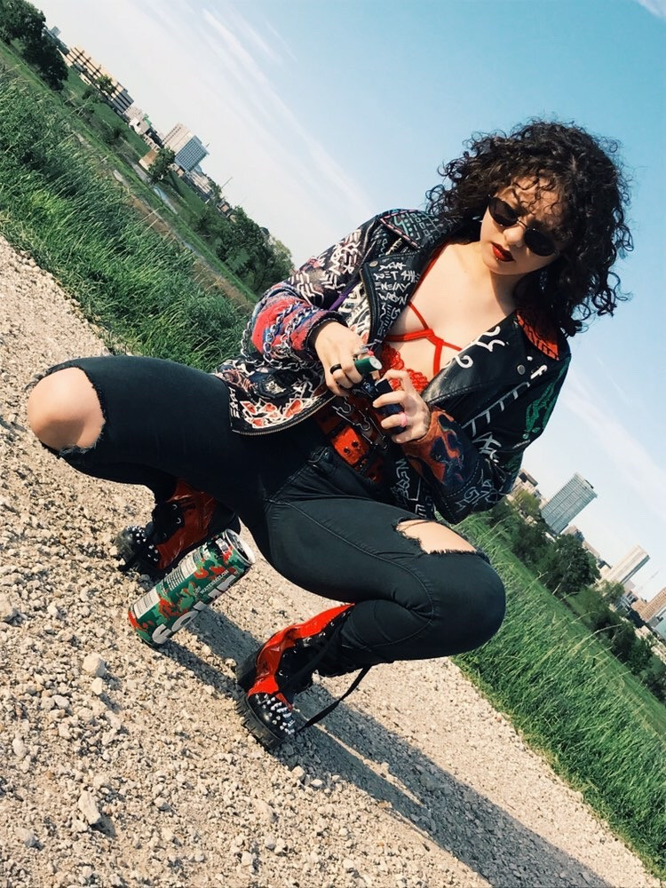 @lucydrips wearing custom clown leather jacket with chain designed by Ke'Ondris