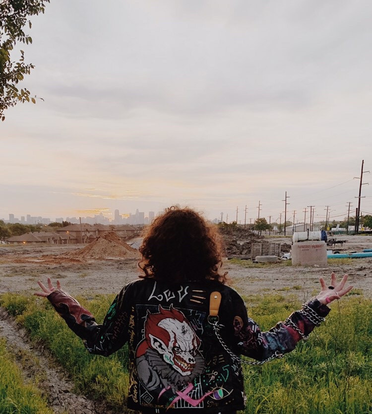 @lucydrips wearing custom clown leather jacket with chain designed by Ke'Ondris