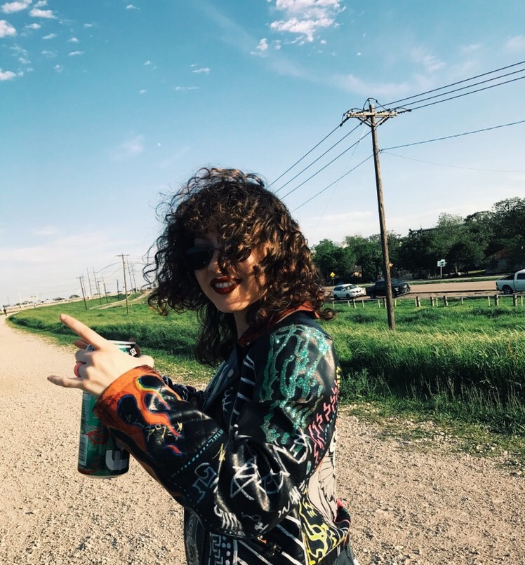 @lucydrips wearing custom clown leather jacket with chain designed by Ke'Ondris