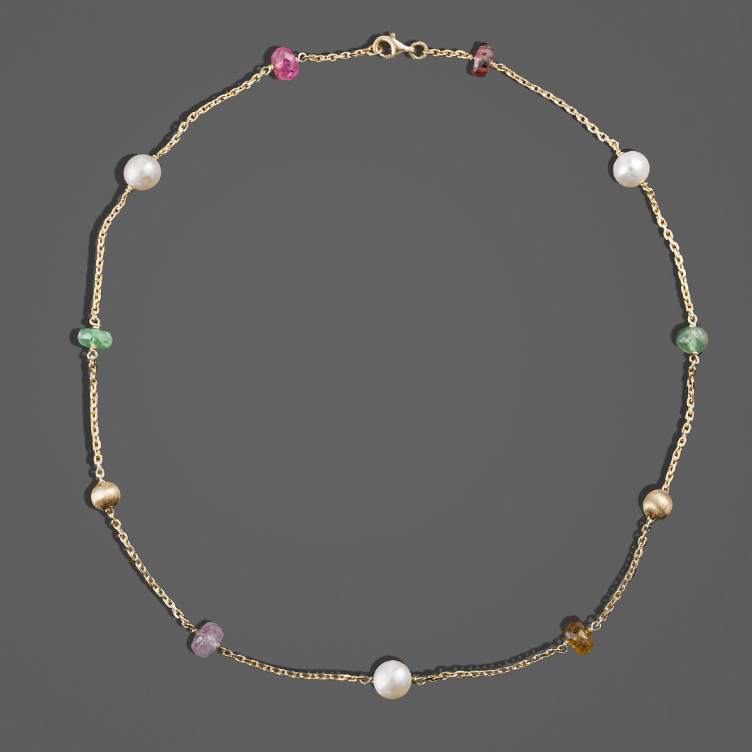 Zlatna ogrlica sa kamenčićima.