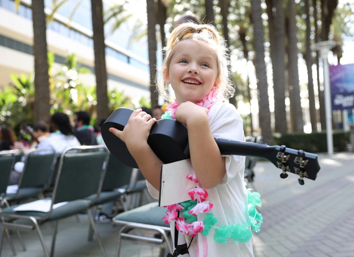 Young guest enjoying an outdoor family event beside live equipment