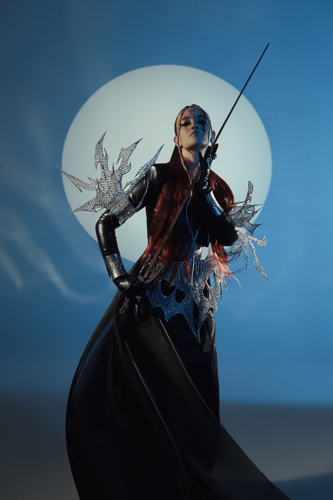 Conceptual fashion editorial portrait with dramatic styling