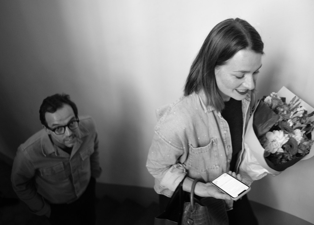 Guest receiving flowers during an intimate celebration in Paris