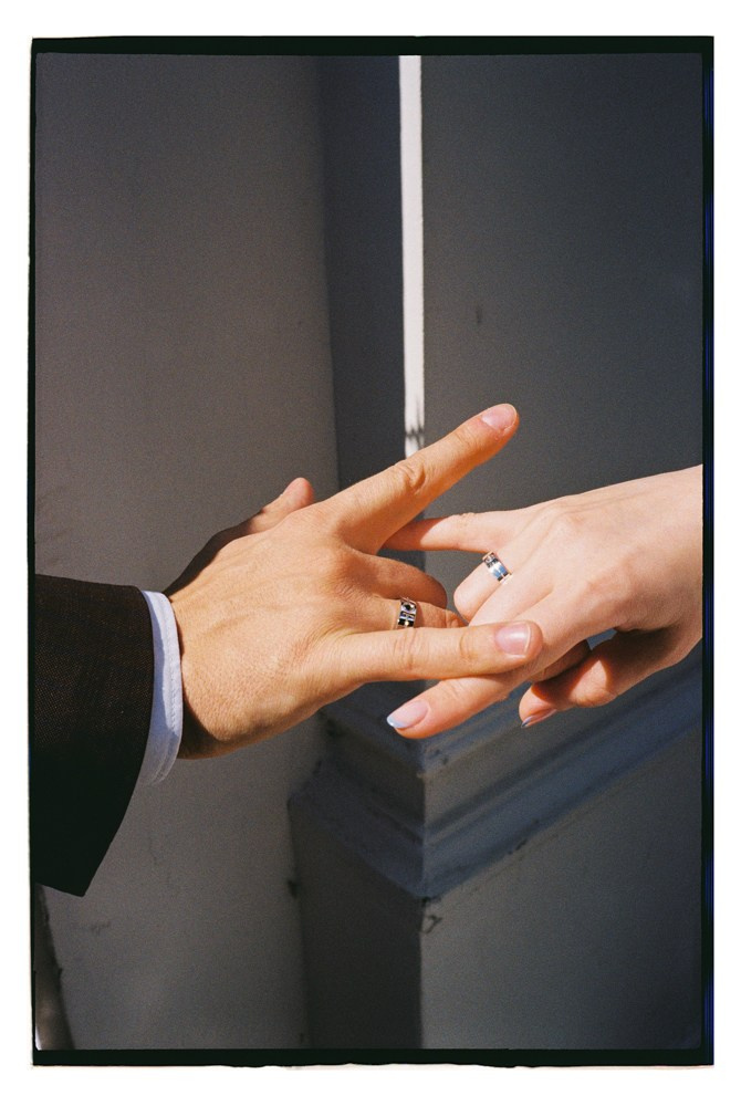 Close up of hands with rings during wedding preparation in Lake Como, Italy